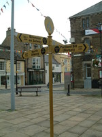 A sign showing distances to the four corners of Britain