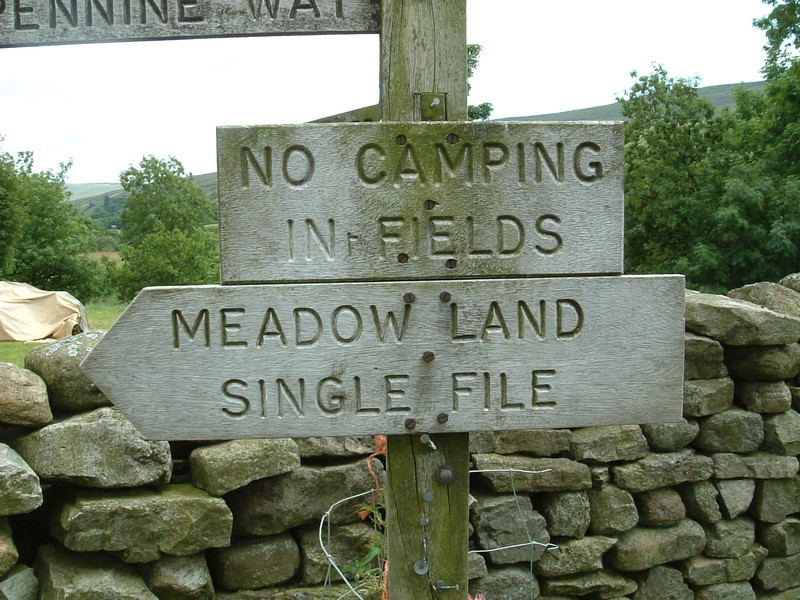 A sign saying 'No Camping in t' Fields'