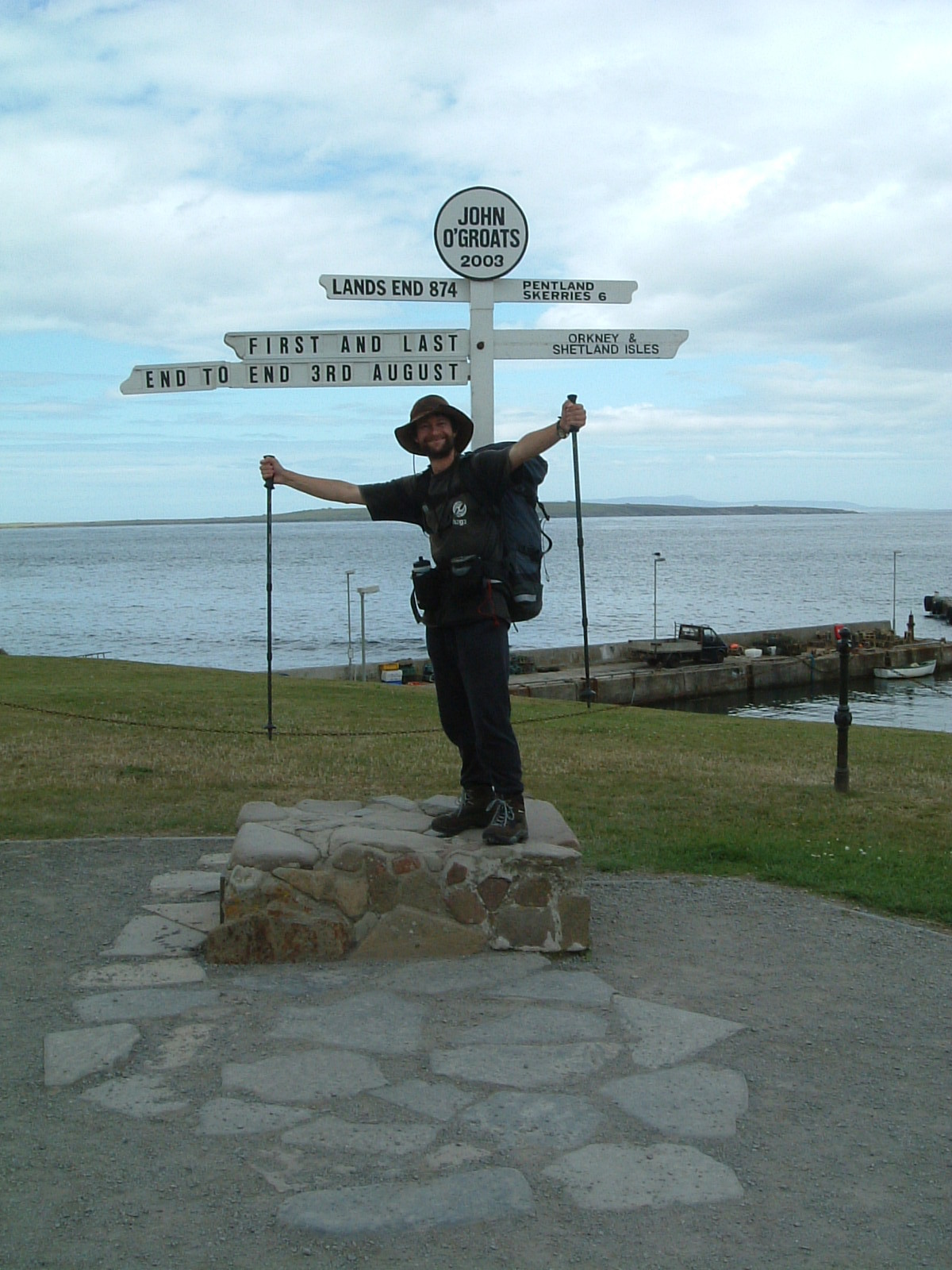 Mark posing by the signpost at John o'Groats