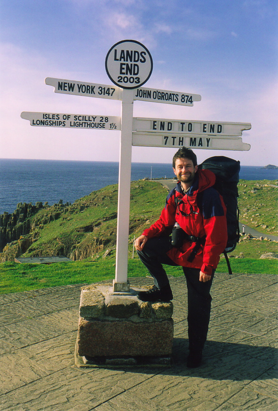 Mark posing by the Land's End signpost before setting off for John o'Groats