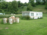 A not-so-posh static caravan gently mouldering by the River Severn