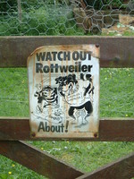 A sign saying 'Beware of Rottweiler'